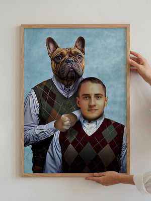 A person holds a framed Step Brothers portrait of a man and French bulldog in matching argyle vests and shirts on a blue background, creating a funny family photo—ideal as personalized dog canvas or unique pet artwork.