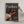 A person hangs a Custom Pet Magazine Cover titled Furbes, featuring a happy dog named Maximus Legrand—one of America’s richest self-made dogs—creating the perfect personalized dog canvas for any home.
