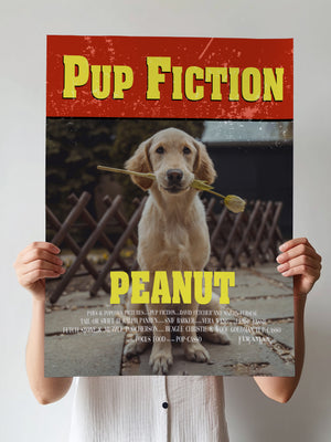 A person holds a Pup Fiction Pet Portrait—a parody movie poster featuring Peanut the golden retriever with a stick, styled after a famous film poster. It’s the perfect quirky pet lover gift or unique pet artwork for your home.