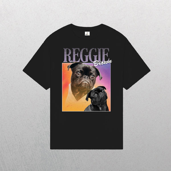 The Personalised Homage Tee | Cosmic is a black T-shirt with two pugs—one colorful, one black and white—beneath “REGGIE and Brown” on a vibrant gradient. A unique keepsake and perfect gift for pet lovers who cherish their furry friends.