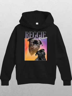 The Personalised Homage Hoodie | Cosmic is a unisex hoodie with two pug illustrations—one colored, one black and white—on a pink-orange gradient square, “REGGIE” and “Brooklyn” above. Add your pet’s name for a unique touch.