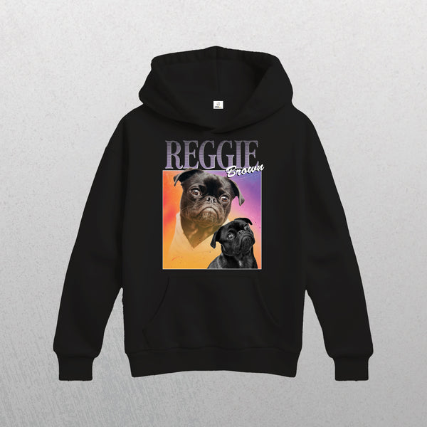 The Personalised Homage Hoodie | Cosmic is a unisex hoodie with two pug illustrations—one colored, one black and white—on a pink-orange gradient square, “REGGIE” and “Brooklyn” above. Add your pet’s name for a unique touch.