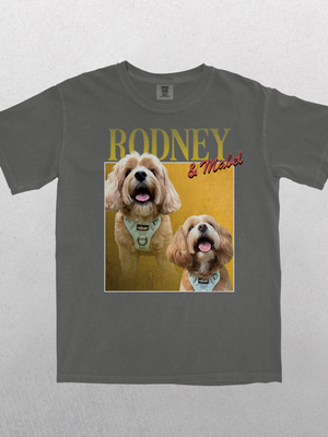 The Personalised Homage Tee | Gold in gray features two happy light-brown dogs in harnesses, with RODNEY in bold yellow and & Mitchel in red script—an ideal keepsake or thoughtful gift for any pet lover.