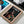 A Color Oneline Art Pet Portrait, featuring a dog in a royal military uniform with GUCCI above, is displayed alongside other framed pieces like a cat in space attire—perfect pet artwork or gift for pet lovers.