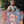A smiling man stands by an open car trunk, holding his dog and an Oil Masterpiece - Custom Pet Portrait of the same dog—an ideal gift for pet lovers—against a leafy outdoor backdrop.