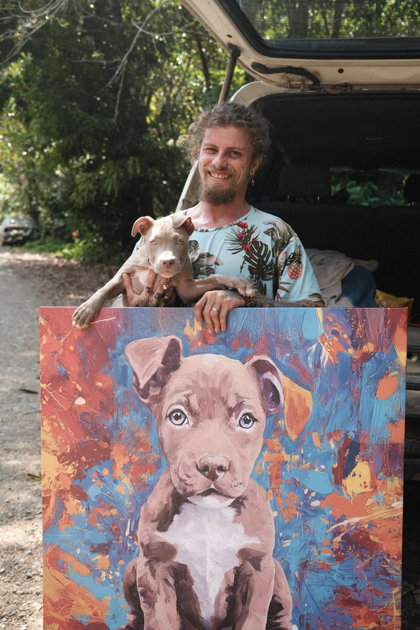 A smiling man stands by an open car trunk, holding his dog and an Oil Masterpiece - Custom Pet Portrait of the same dog—an ideal gift for pet lovers—against a leafy outdoor backdrop.
