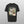 A gray Personalised Homage Tee | Jungle featuring two blue-eyed cats on a green background with ZURIAKA Hutchinson—a unique gift for pet lovers.