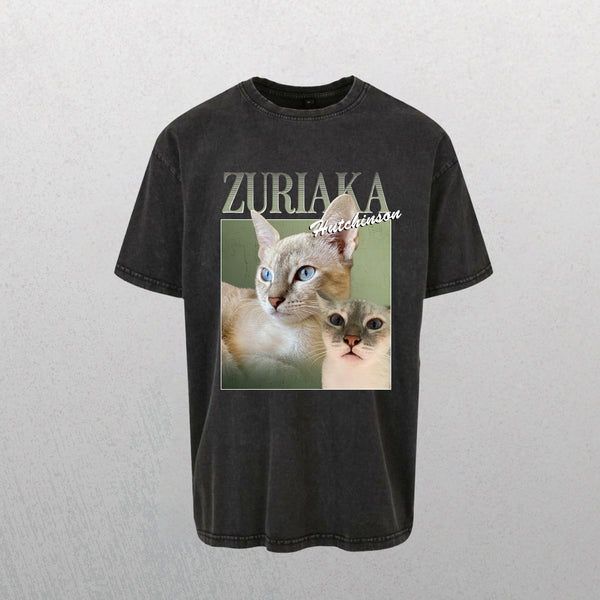 A gray Personalised Homage Tee | Jungle featuring two blue-eyed cats on a green background with ZURIAKA Hutchinson—a unique gift for pet lovers.