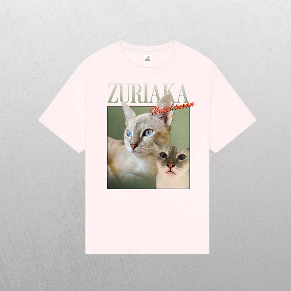 A light pink Personalised Homage Tee | Jungle featuring a photo collage of a blue-eyed, light-furred cat, with ZURIAKA in bold above and Hutchinson in red cursive—an ideal gift and unique pet keepsake for cat lovers.