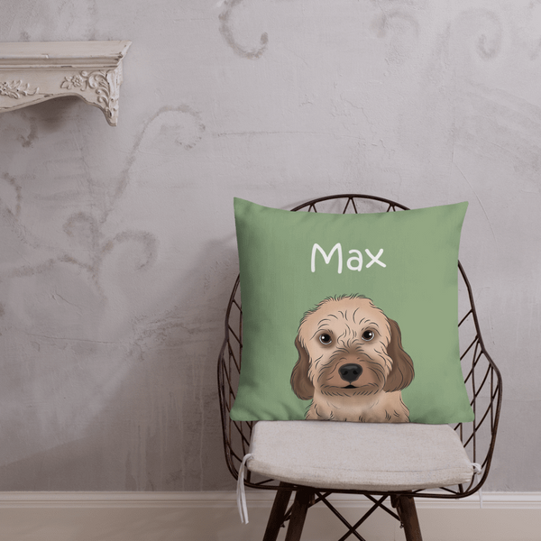A Custom Cartoon Pet Cushion featuring a green design, an illustrated dog, and the name Max sits on a wire chair before a light gray decorative wall—an ideal gift for pet lovers.