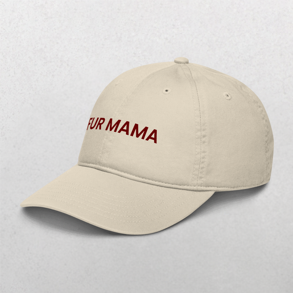 The Classic Organic Dad Cap - Furr Mama is a beige, trendy cap for dog lovers with FUR MAMA embroidered in red on the front, shown against a plain light background.
