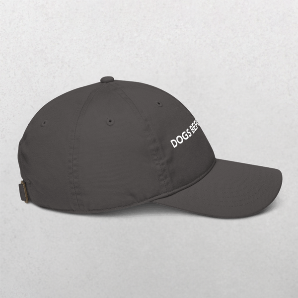 The Classic Organic Dad Cap - Dogs Before Dudes is a stylish black baseball cap with DOGS BEFORE embroidered in white, ideal for dog moms or dads. Shown on a light gray background.