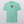 The Embroidered Pet Portrait Organic T-Shirt in light teal features a small embroidered cartoon dog face on the upper chest, making it a unique pet keepsake or a fun, casual wardrobe addition.