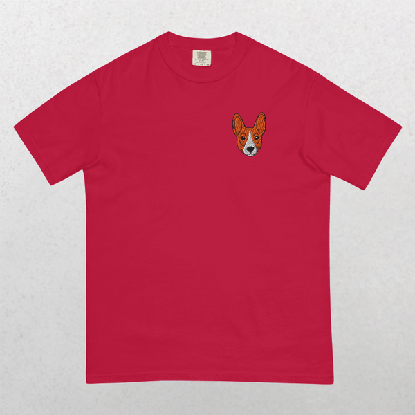 The Embroidered Pet Portrait Organic T-Shirt is a red vintage pet tee with a small corgi dog face embroidered on the left chest, set against a plain light gray background.