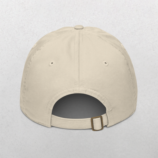 The Classic Organic Dad Cap - Furr Mama is shown from the back in beige, featuring Furr Mama embroidery, an adjustable metal-buckle strap, and two stitched ventilation holes per side. Background is a light neutral shade.