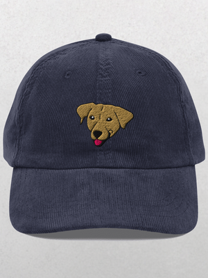 The Custom Pet Portrait Corduroy Cap in navy features an embroidered brown dogs head with its tongue out, centered on the front—a unique keepsake hat for any dog lover.