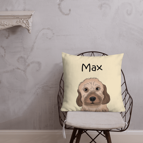 The Custom Cartoon Pet Cushion on a chair displays a cartoon dog with Max above it. Set against a light wall, its a perfect pet lover gift or unique pet memorial keepsake.
