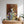 The Notorious D.O.G. custom pet portrait shows a bulldog in a gold crown and ornate robe above a dresser with plants, set in a bright, cozy room—making it the perfect gift for pet lovers.