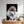 A framed Star Wars Stormtrooper dog head artwork hangs above a wooden dresser with potted plants—a unique, modern pet lover gift for bright spaces.