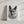 The Pencil Sketch Art is a black and white custom pet portrait of a dog with upright ears, printed on canvas and displayed leaning against a light-colored wall with shadows cast in the background.